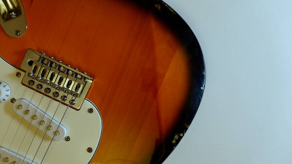 Electric guitar closeup . White background