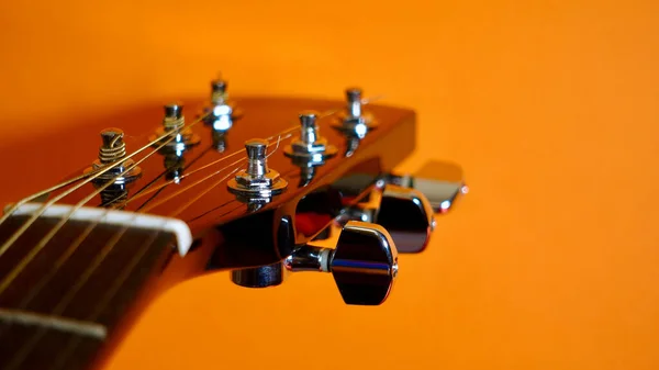 Guitar Headstock Closeup Orange Background Copy Space — Stock Photo, Image