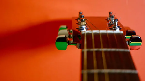 Guitar Headstock Closeup Orange Background Copy Space — Stock Photo, Image