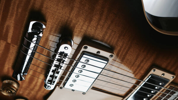 Electric guitar body closeup . Color light