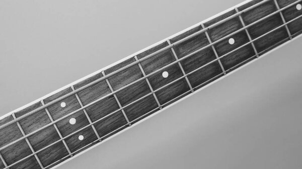Bass guitar neck closeup . black and white