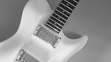 Beyaz elektro gitar yakın plan. Kopyalama alanı olan beyaz arkaplan