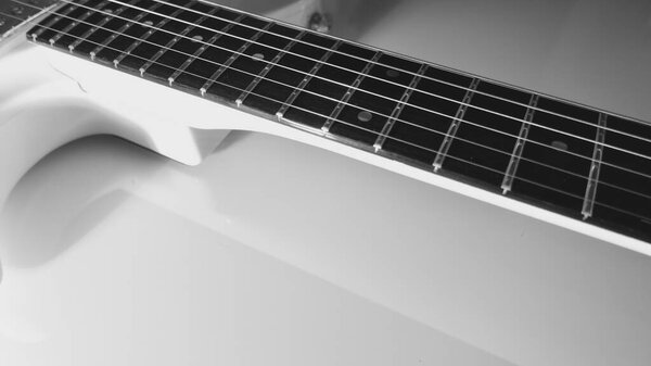 White electric guitar closeup . White background with copy space