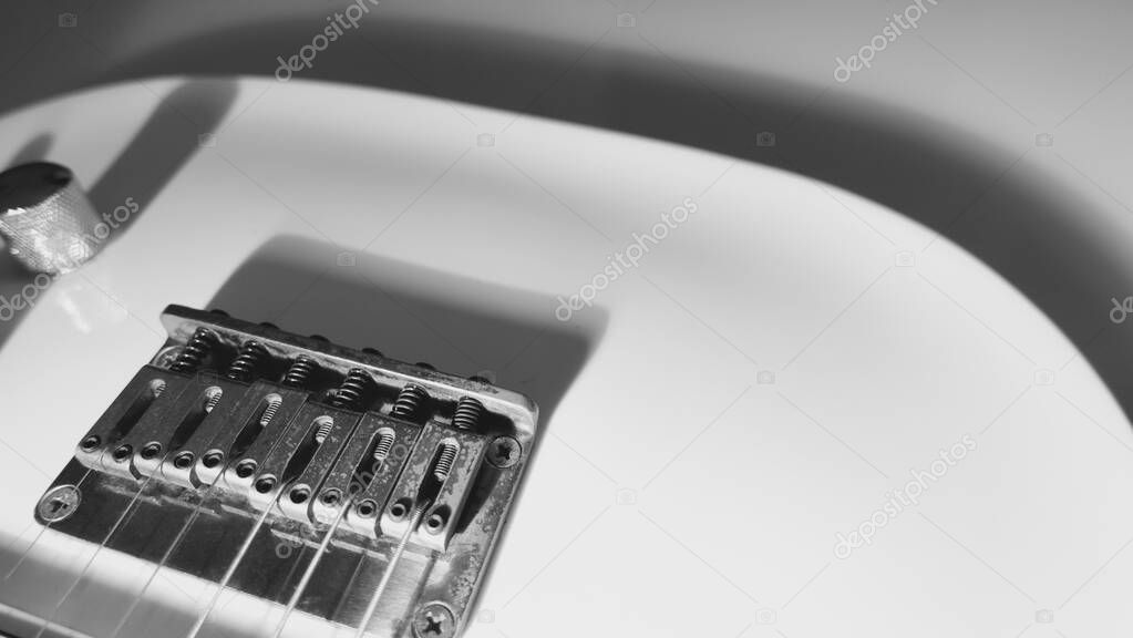 white electric guitar closeup . White background with copy space