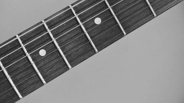 Guitar neck closeup with copy space . black and white