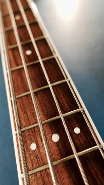 Bass Guitar Neck Copy Space Blue Background — Stock Photo, Image