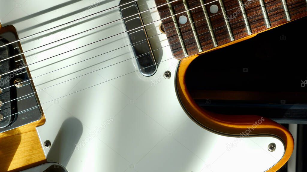 electric guitar closeup . dark background