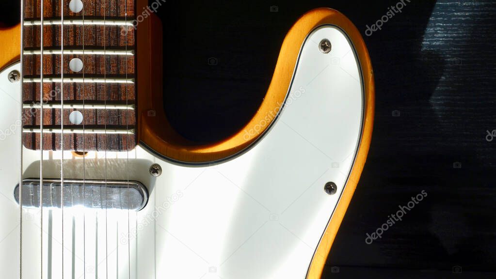 electric guitar closeup . Dark background