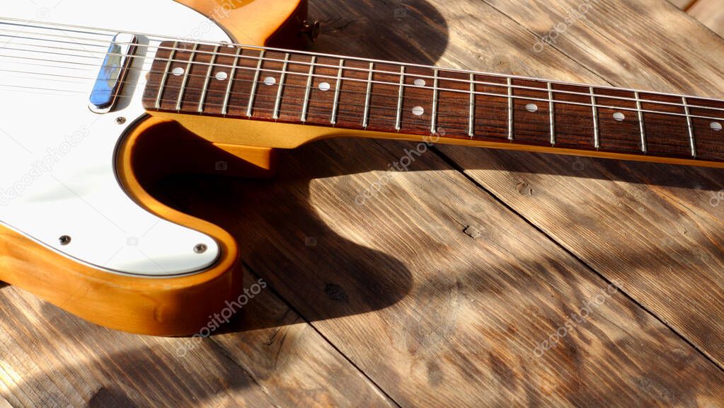 vintage electric guitar  on the wooden boards.