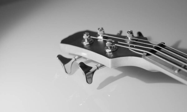 Bass guitar headstock closeup . Black and white
