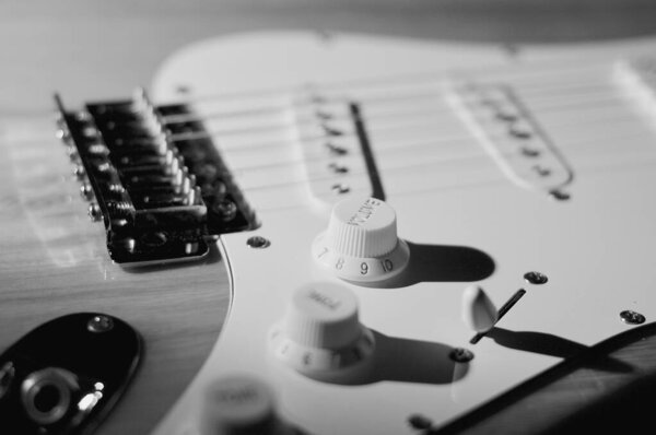 Electric guitar closeup . Black and white