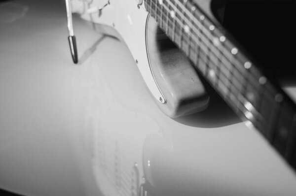 Electric guitar closeup . Black and white