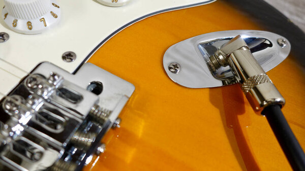 Electric guitar closeup and guitar jack . Copy Space