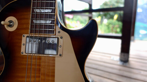 Vintage electric guitar on the wooden boards . Copy Space
