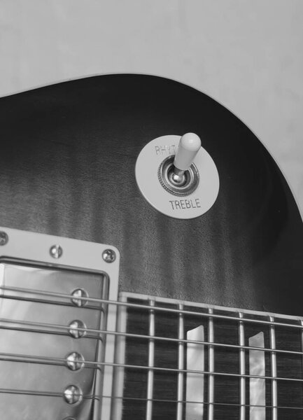 Electric guitar closeup. Copy space . Black and white