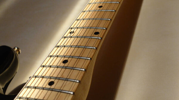 Electric guitar headstock closeup . Color background