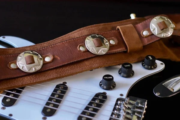 electric guitar closeup and guitar strap