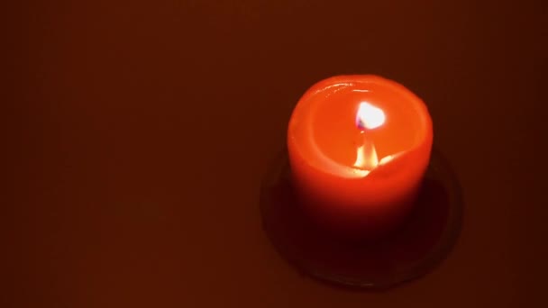 Burning Red Candle Red Background Slow Motion 100P — Stock Video