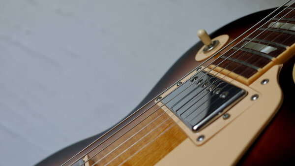 Electric guitar closeup . White background with copy space