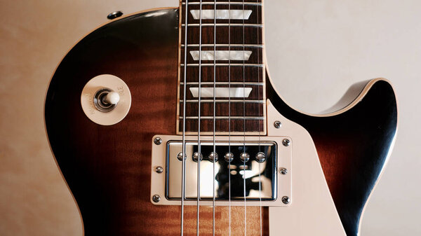 Vintage electric guitar closeup . Dark background with copy space