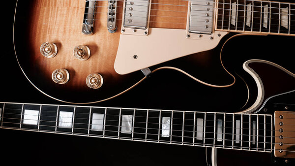 Vintage electric guitar closeup . Dark background with copy space