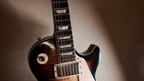 Vintage electric guitar closeup . dark background with copy space