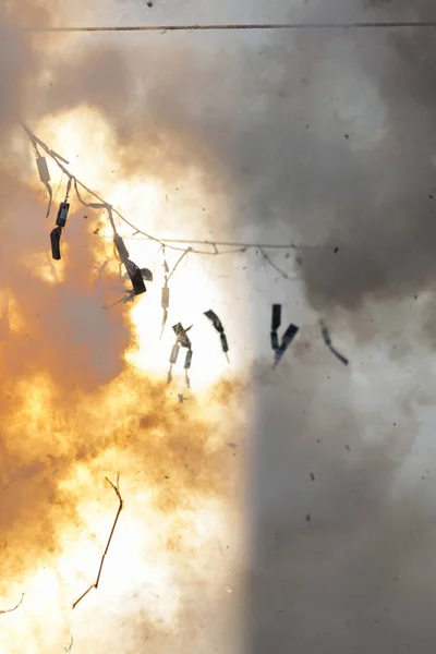 fireworks exploding with smoke around