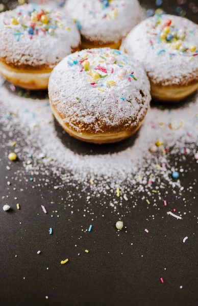 Donuts sprinkled with powdered sugar. — Stock Photo, Image