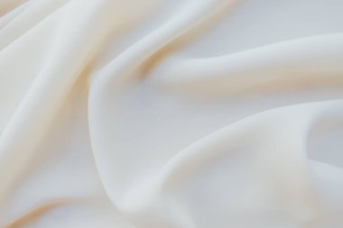 Beyaz ve bej kumaşın arkaplan dokusu.