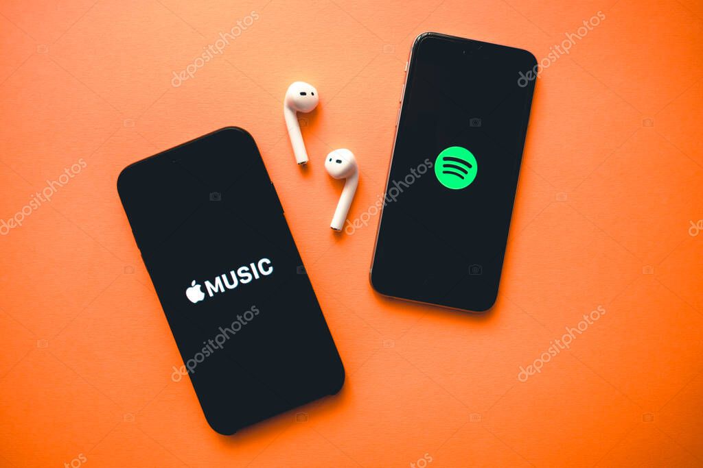 Screen shot of Apple music app and Spotify. Apple Music and Spotify the most popular music streaming services.