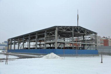 Small multi-purpose building on a cloudy day