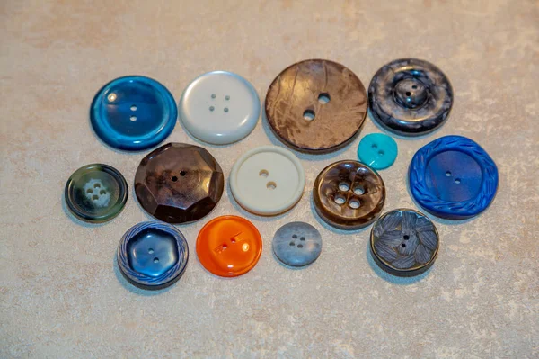 Old retro buttons for vintage clothes, creative and sewing on a light background