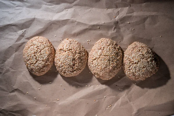 Homemade Gluten Free Bread. A gluten free breads on craft background. green buckwheat flour bread with sesame. Place for text. concept healthy food