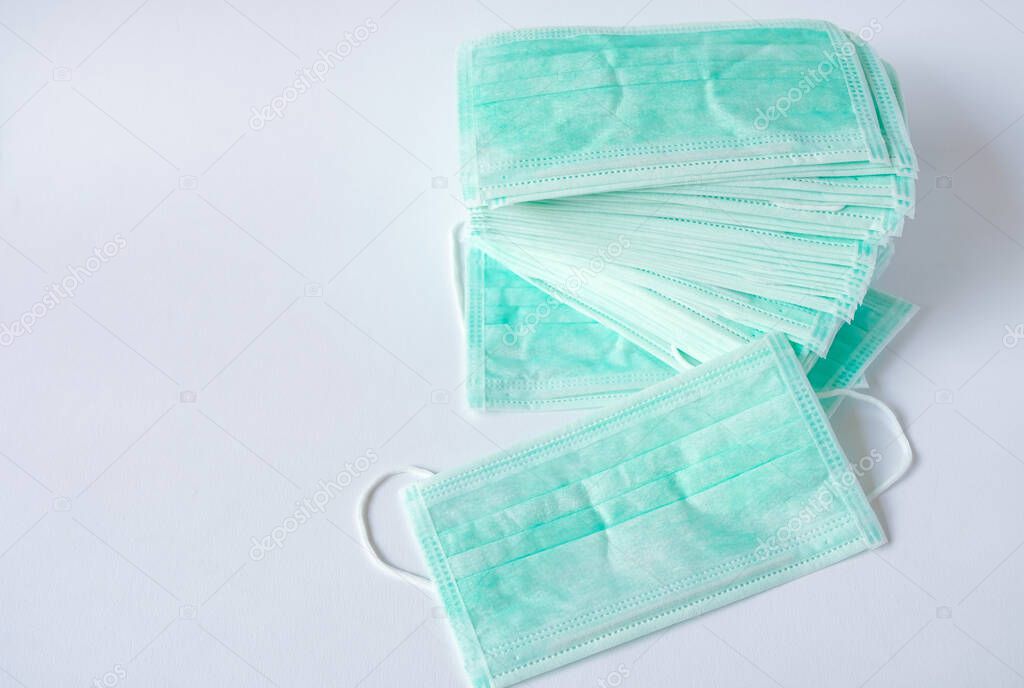Green color Medical mask for protection against flu and other diseases. Surgical protective mask. Medical respiratory bandage face on isolate white background. prevention of the spread of virus