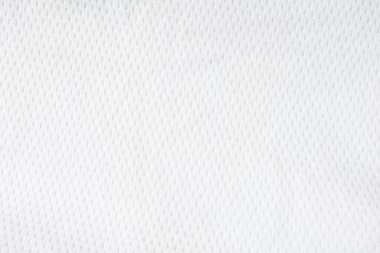 Beyaz örgü örgü kumaş arka plan. Spor giysileri egzersiz için giyilir. Hafif, iyi hava akışı, serin ve terden kuruması kolay. Metin için kopyalama alanı olan soyut duvar kağıdı.