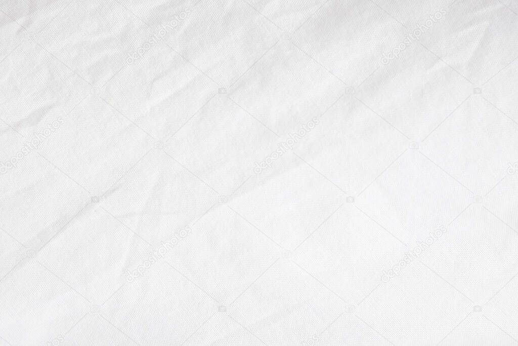 Wrinkled White fabric close up shot of good quality Cotton and polyester shirt. formal wear for office worker . Background texture concept with copy space for text.