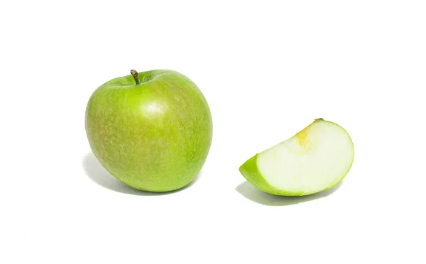 Green apples and apple slices isolated on white background.