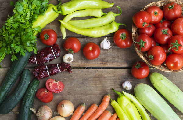 Various fresh vegetables from market on wooden background with space for text. High angle view