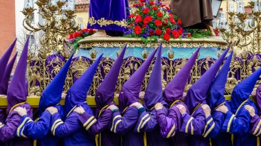 Traditional Spanish Holy Week procession in the streets of Palencia, Spain clipart