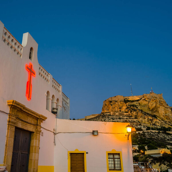 View of the small hermitage of Santa Cruz at dusk, in the Mediterranean city of Alicante, Spain