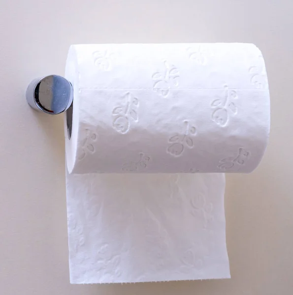 Toilet paper roll hanging under the roll