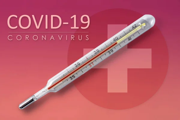 High temperature measured on an analog thermometer, a common symptom of covid-19 coronavirus
