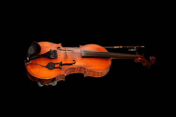 Violino e arco isolado sobre fundo preto . — Fotografia de Stock