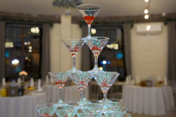 A pile of champagne glasses at a party. — Stock Photo, Image