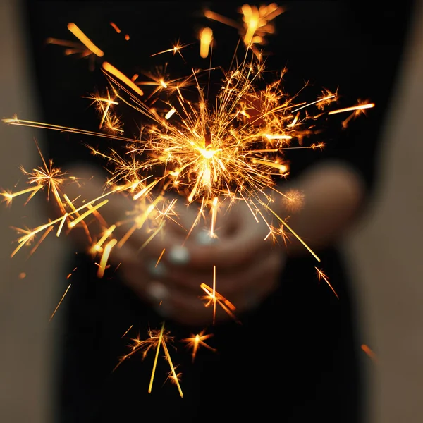 Amazing sparklers in female hands. — Stock Photo, Image