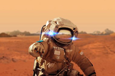 Spaceman walks on the red planet Mars. Space Mission. Astronaut travel in space