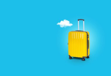 Sarı çanta bir bulut, seyahat kavramı ile mavi bir arka plan üzerinde. Tasarım ile boş bir alan