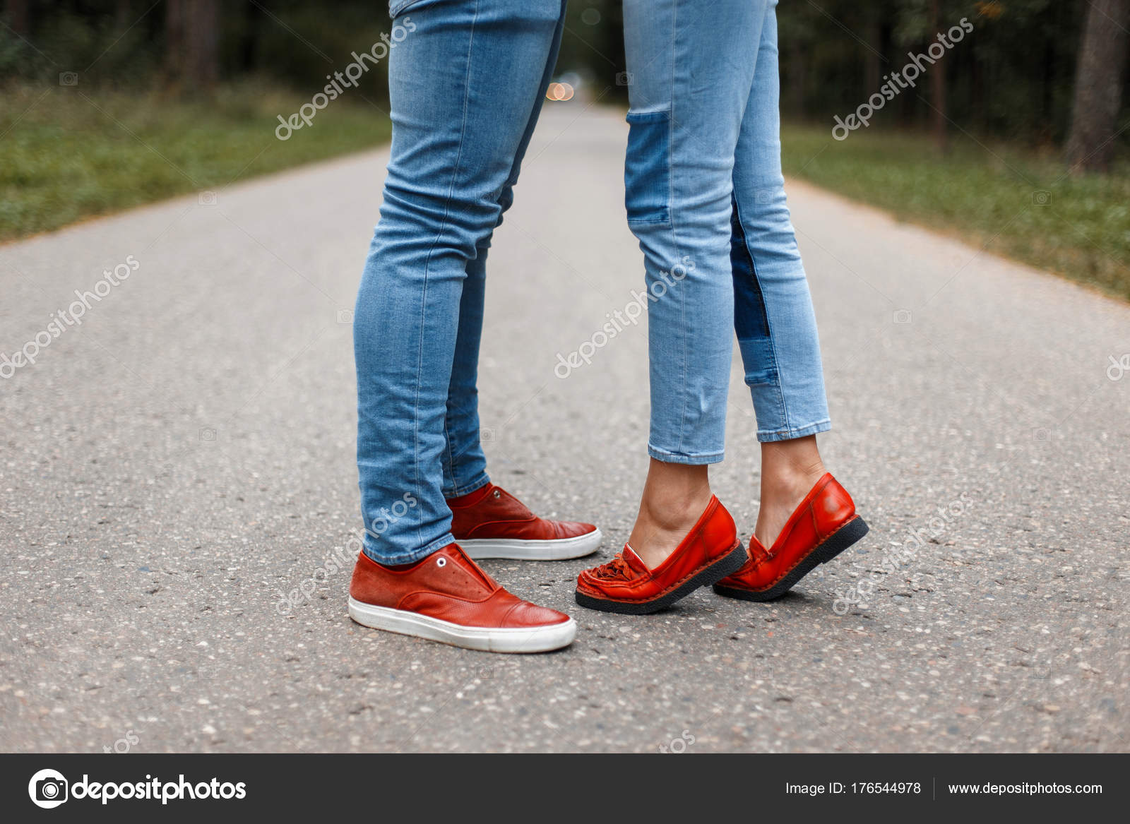 Loving couple kissing on the road. Male and female legs in stylish shoes on  the asphalt Stock Photo by ©alonesdj 176544978