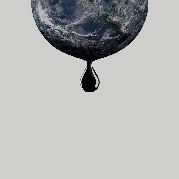 Капля нефти капает с планеты Земля. Добыча нефти — стоковое фото