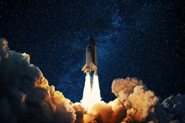 Rocket takes off in the starry sky. Spaceship begins the mission. Space shuttle taking off on a Planet Mars. 